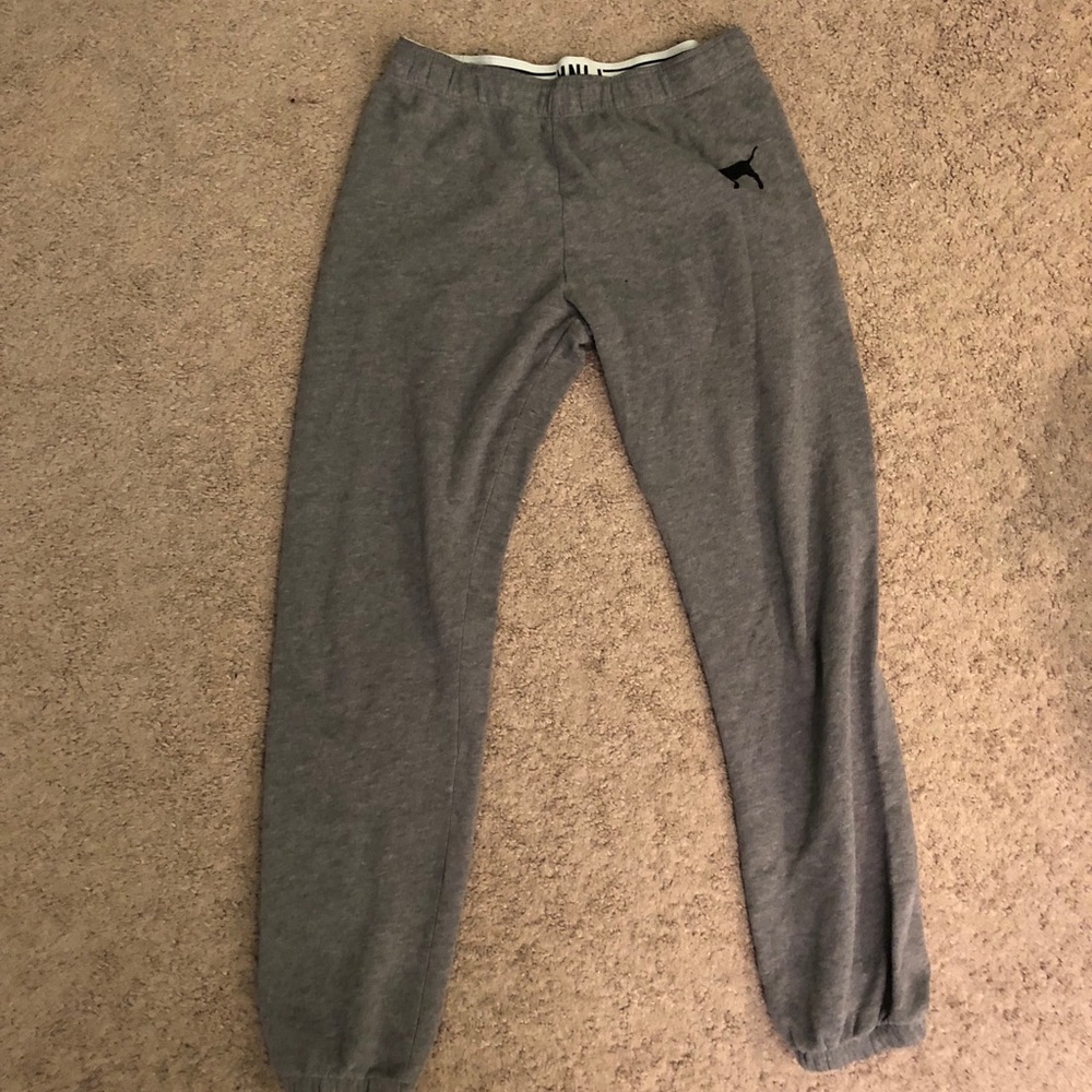 Grey sweatpants. Cuffed ends.